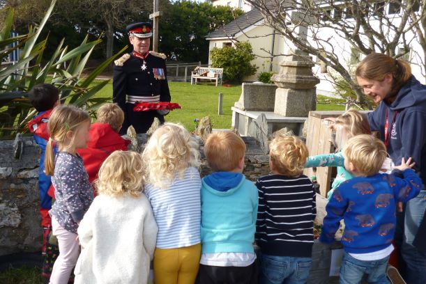 Lord Lieutenant interacting with local children when laying wreath